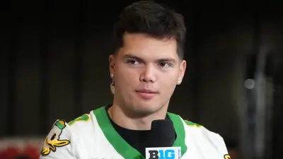Dillon Gabriel in front of a microphone