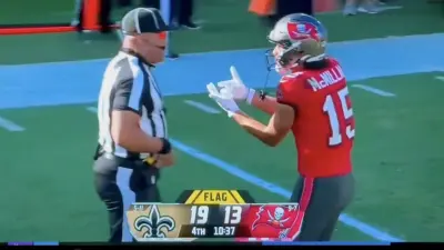 Buccaneers rookie Jalen McMillan pleading with a referee