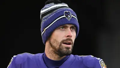 Justin Tucker looking on