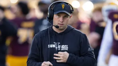 Kenny Dillingham in a hat and headset