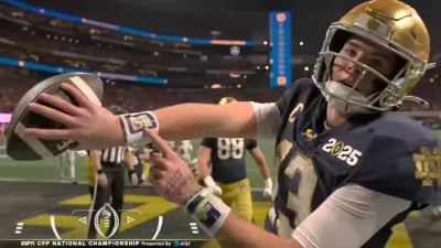 Riley Leonard points to his wrist