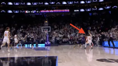 Trae Young shooting a halfcourt shot during a Hawks-Jazz game
