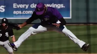 Jefry Yan leaps into the air after a strikeout
