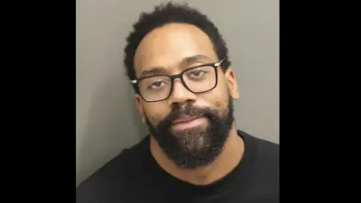 Marcus Jordan poses for a mugshot
