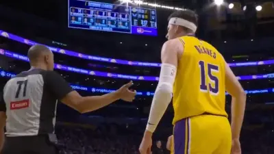 Austin Reaves approaching a referee
