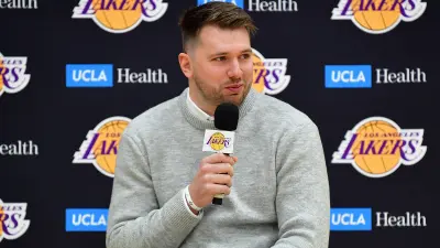 Luka Doncic holds a microphone