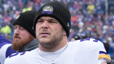 Garrett Bradbury looks on