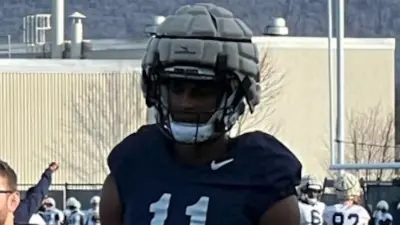 LaVar Arrington II standing on the practice field