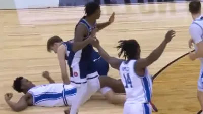A Duke player on the ground