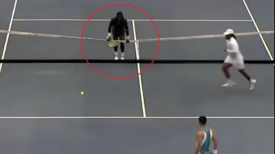 Frances Tiafoe by the net