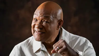 George Foreman holding up a fist