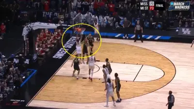 A Houston player goes up for a dunk