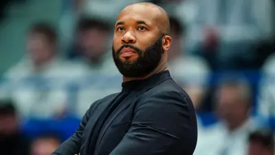 Kyle Neptune looking on during a game