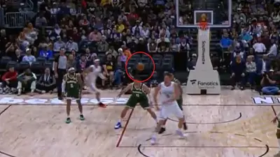 Nikola Jokic passes a ball
