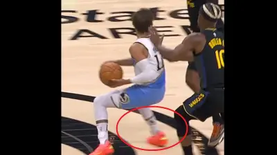 Trae Young committing a traveling violation