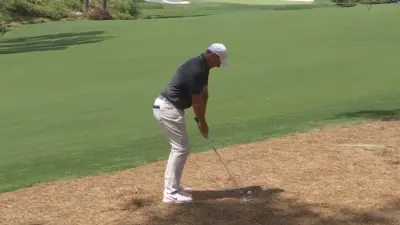 Rory McIlroy hits a shot out of the pine straw