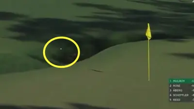 Rory McIlroy has a ball bounce into Raes Creek