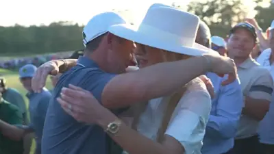 Rory McIlroy hugs his wife Erica after winning the Masters