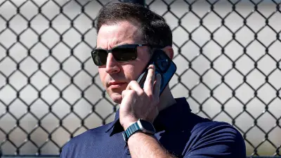 Sam Menzin talks on the phone