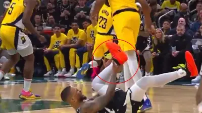 Damian Lillard grabs his ankle