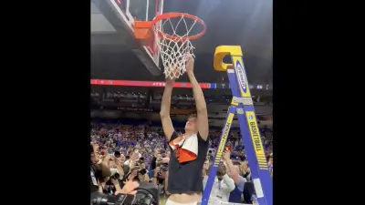Florida center Olivier Rioux cutting down a net