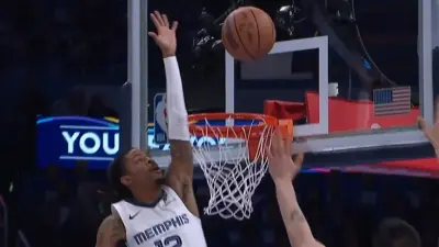 Ja Morant blocking a shot against the Thunder