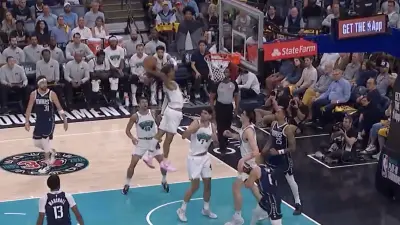 Grizzlies star Ja Morant goes up for a putback dunk against the Mavericks