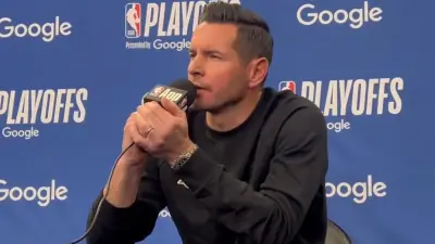 JJ Redick holding a microphone