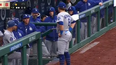 Kiké Hernandez standing in front of the dugout