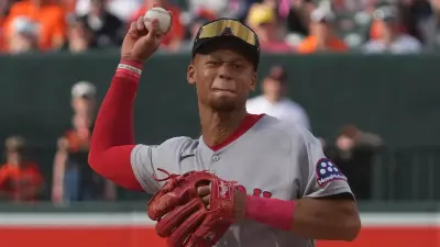 Kristian Campbell holds a ball in his hand ready to throw