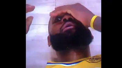 LeBron James peeking while on the floor