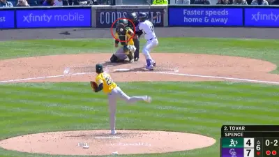 As pitcher throws a ball to the catcher