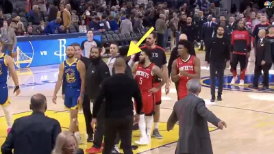 Steph Curry and Ime Udoka exchanging words during a Rockets-Warriors game