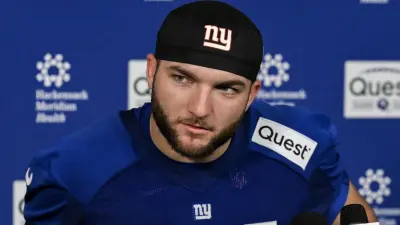 Cam Skattebo at a press conference