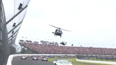 Helicopters fly over the Indy 500 as a tribute to the US Army