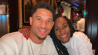 Josh Hart and his wife Shannon pose for a photo