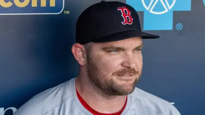 Liam Hendriks sits in the dugout