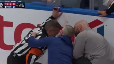 Referee Chris Rooney has his eye examined