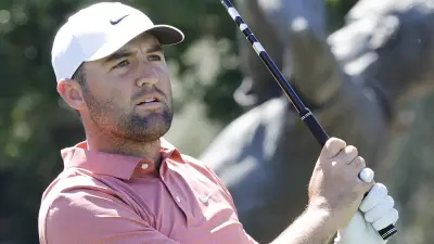 Scottie Scheffler swings a club