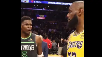LeBron James talks to Anthony Edwards