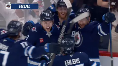 Cole Perfetti celebrating his game-tying goal in Jets-Blues Game 7