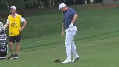 Shane Lowry stands over a divot