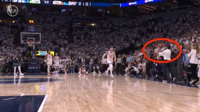 Timberwolves fan catches a ball during Game 4 vs. Thunder