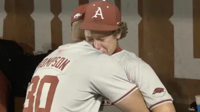 Arkansas outfielder Charles Davalan cries after a costly mistake