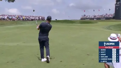JJ Spaun poses after hitting a shot