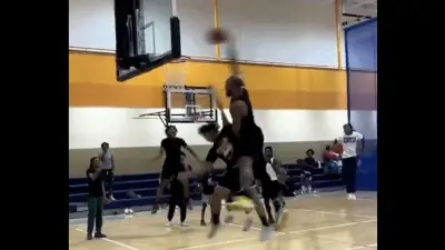 Mavericks center Daniel Gafford dunking on a fan