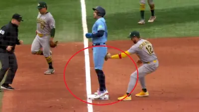 George Springer jumping on third base
