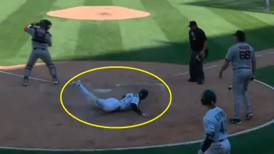 Michael A. Taylor sliding into home plate