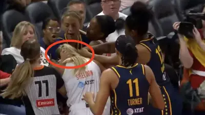 Sophie Cunningham grabbing Jacy Sheldon during Fever-Sun game