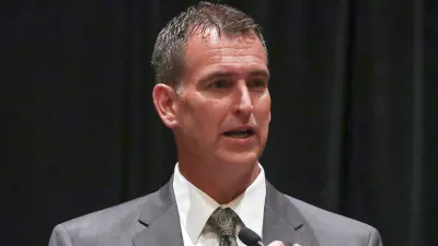 Mack Rhoades at a news conference